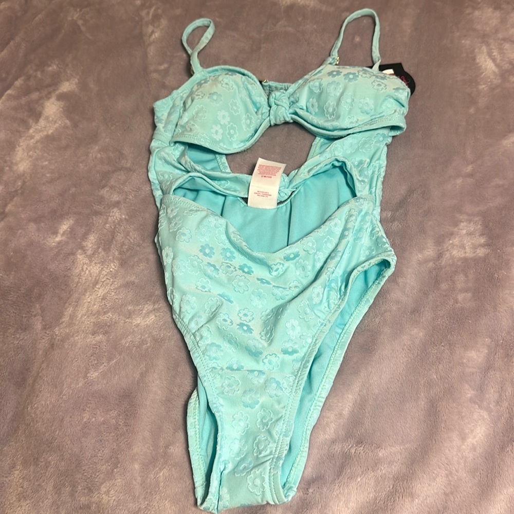 One piece bathing suit with cut outs